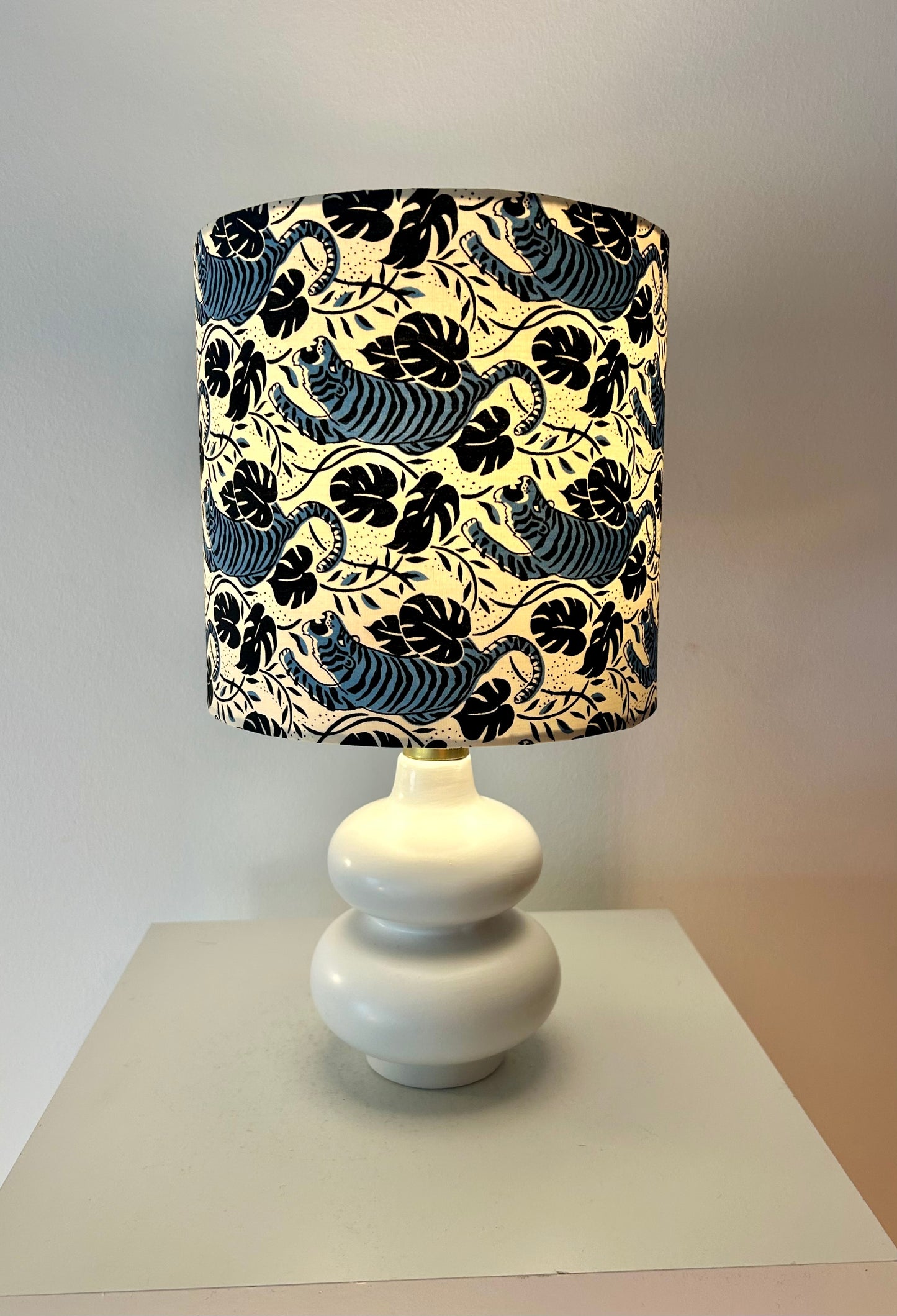 Cordless table lamp with shade made of Japanese tiger fabric