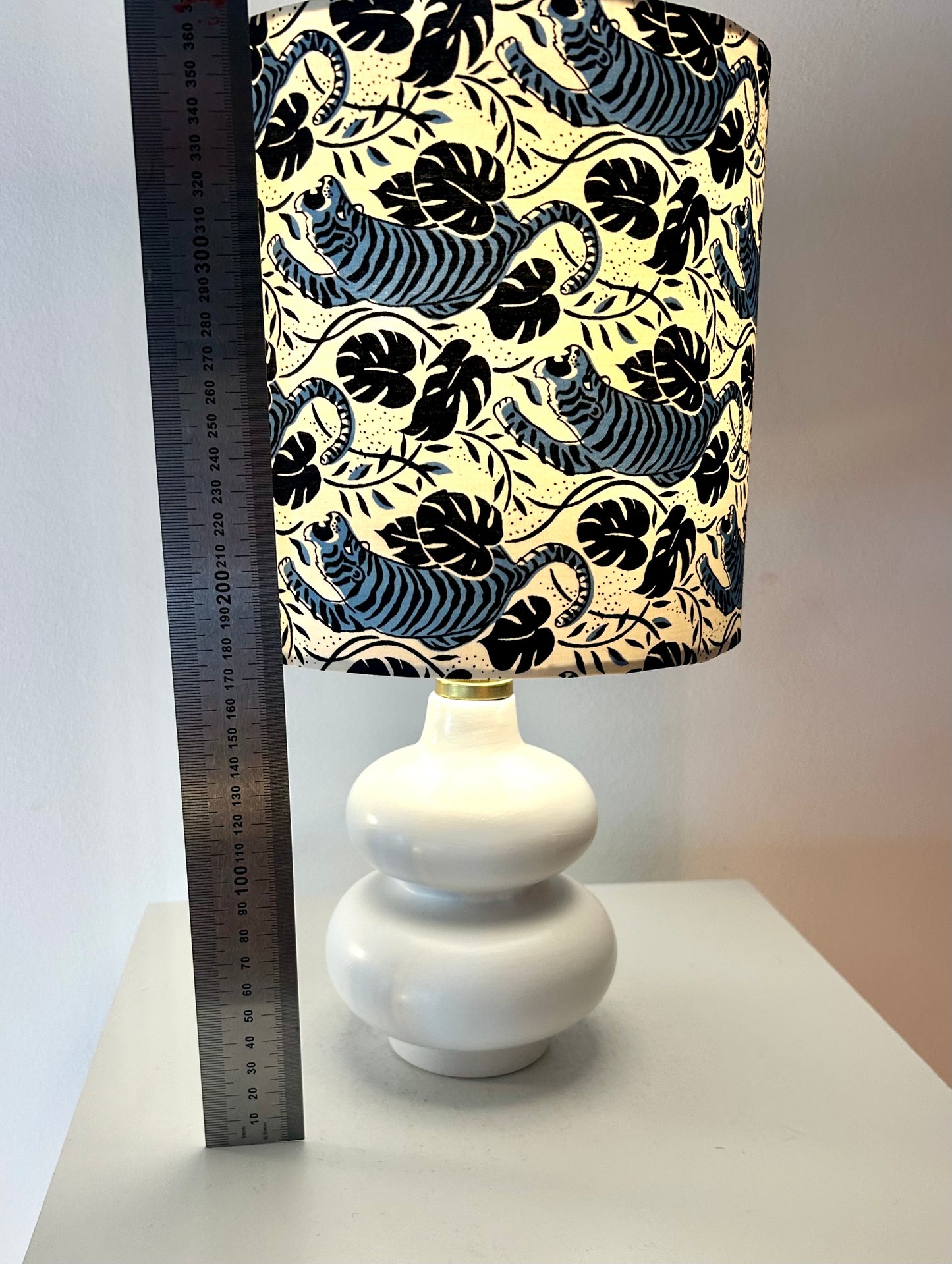 Cordless table lamp with shade made of Japanese tiger fabric